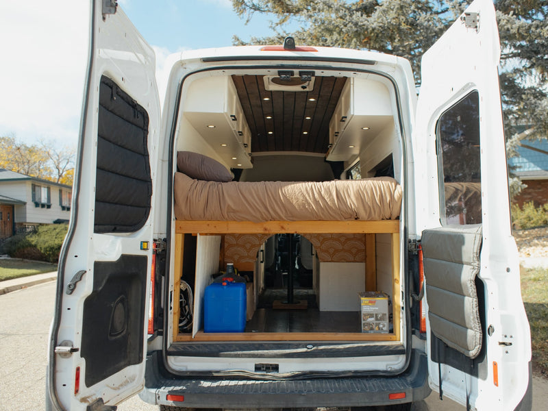  and a compact kitchen counter with a stove.|Modern rv rental interior with a built-in kitchen stove — photo 11