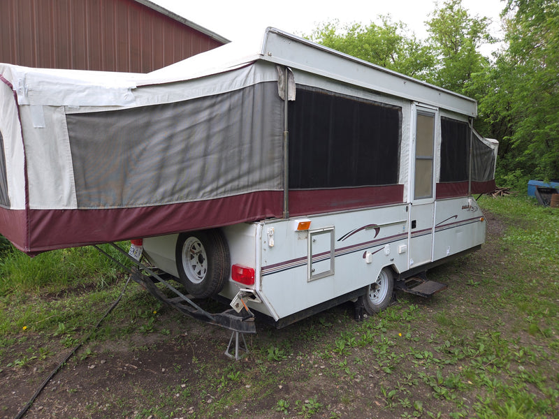 A white and burgundy pop-up RV rental — photo 1