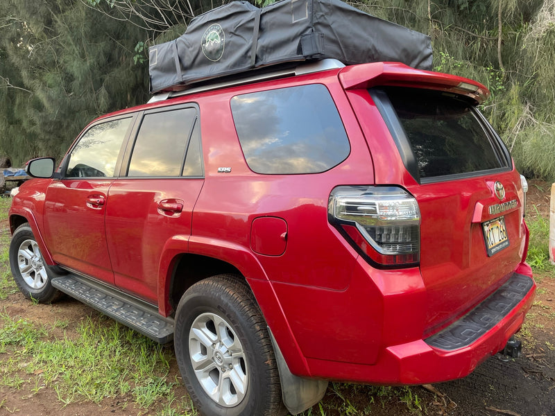 Red Toyota 4Runner SUV with a rooftop tent, offering an ideal RV rental experience for outdoor adventures. — photo 4