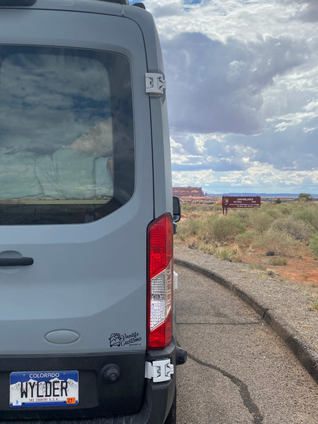 Gray RV rental van at Canyonlands National Park entrance. Colorado road trip adventure awaits!