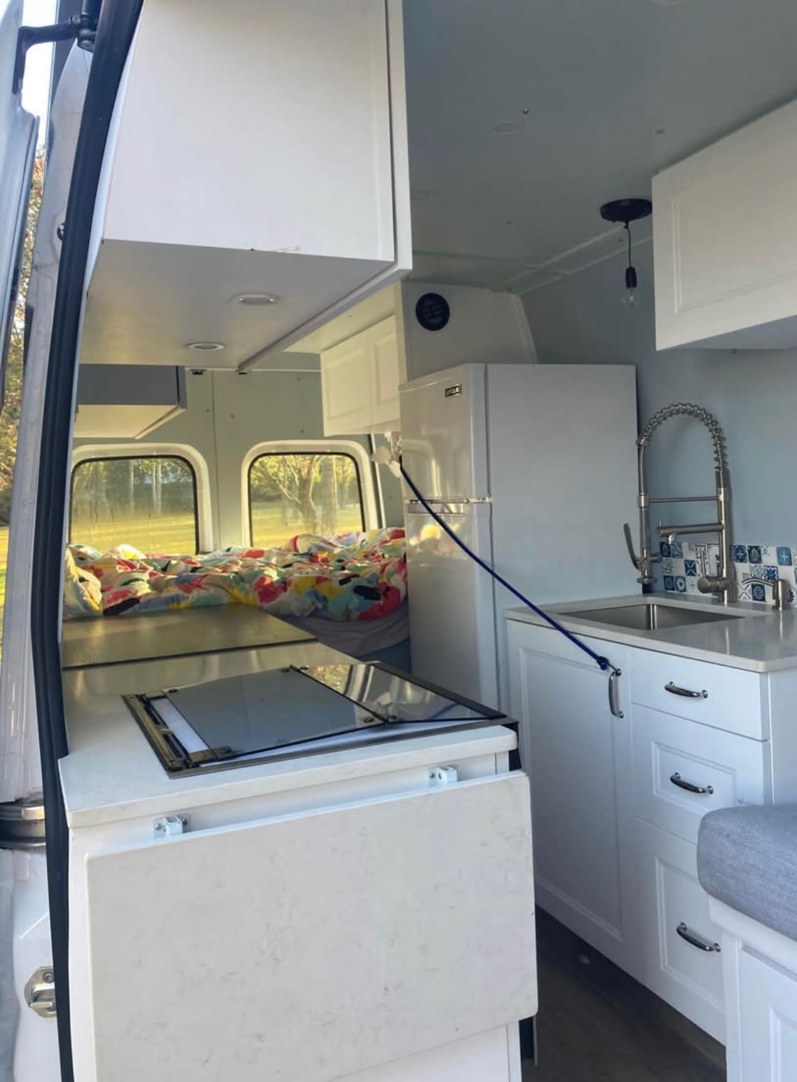 offering off-grid mobile living.|Modern rv rental interior: compact kitchen — photo 4