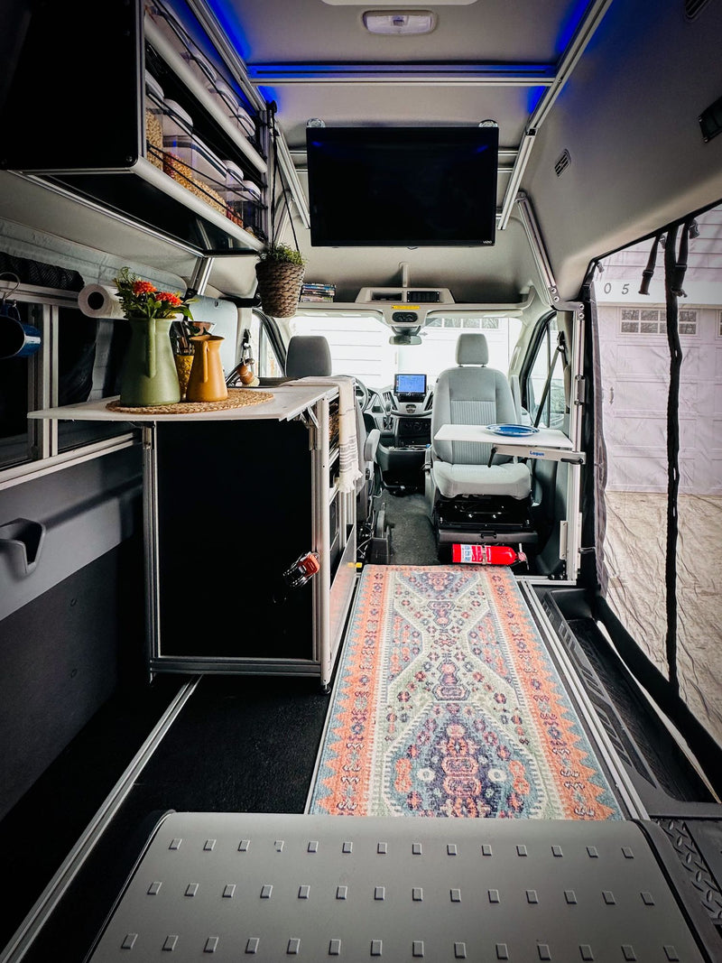  and a versatile Lagun table for comfortable travel.|Cozy RV rental interior: compact kitchen area — photo 9