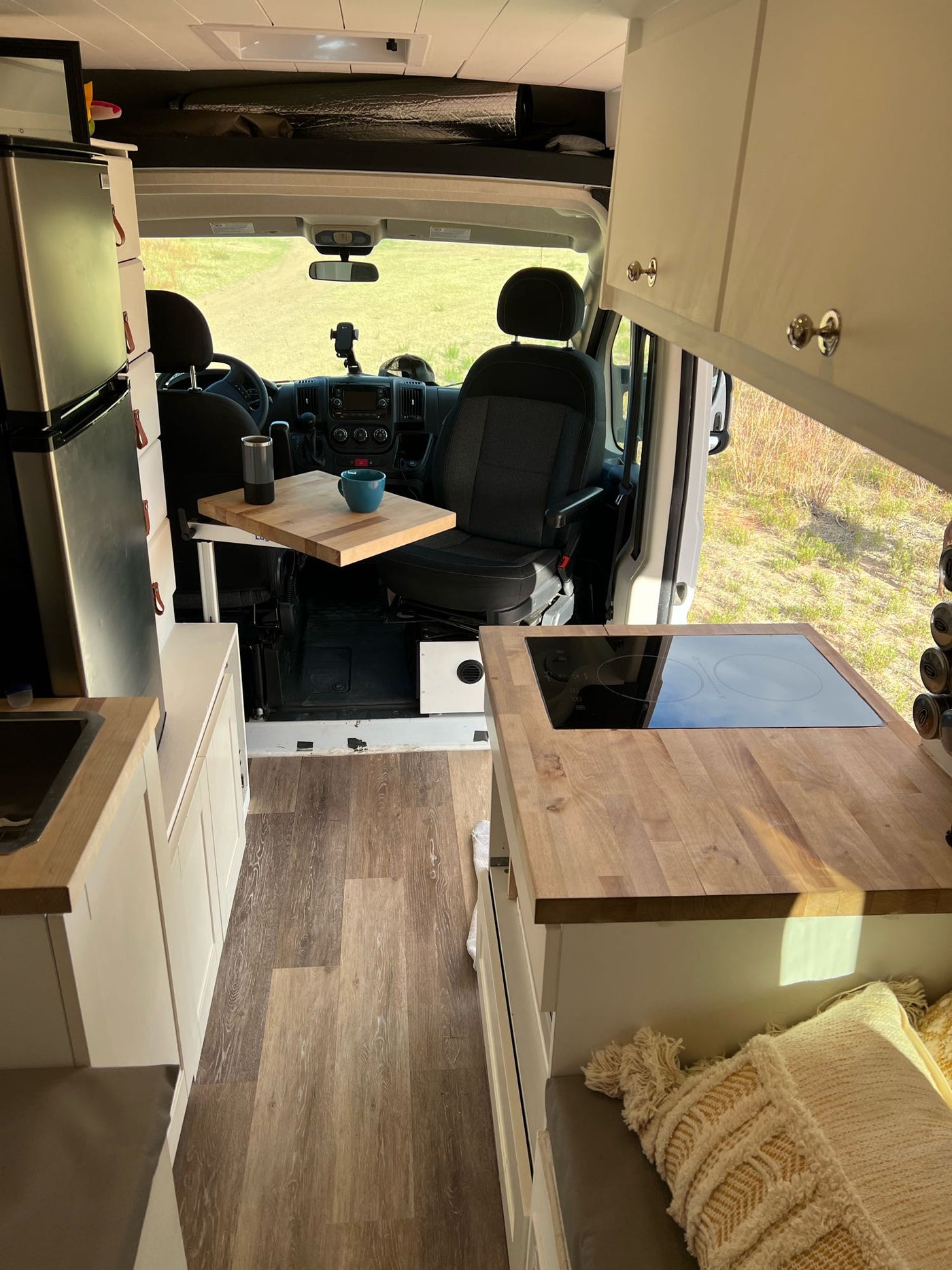  and U-shaped lounge area.|RV rental camper van interior: elevated bed — photo 14
