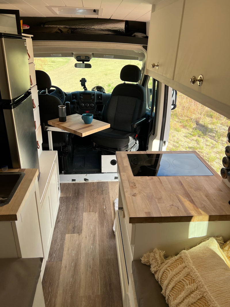  and U-shaped lounge area.|RV rental camper van interior: elevated bed — photo 14