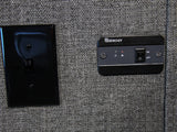RV rental power control: A black light switch & Renogy panel with ON/OFF switch & indicator lights on a grey wall.