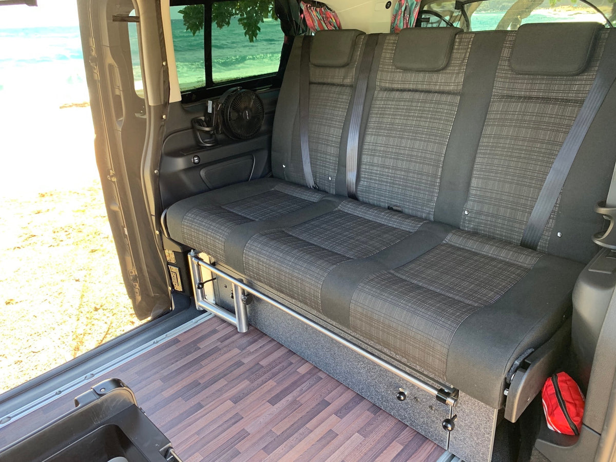  perfect for RV rental.|Explore Hawaii with this RV rental! A pop-top camper van on a sandy beach next to the ocean under a blue sky.|Hawaii RV rental: Mercedes camper van with pop-up roof parked on a sandy beach — photo 8