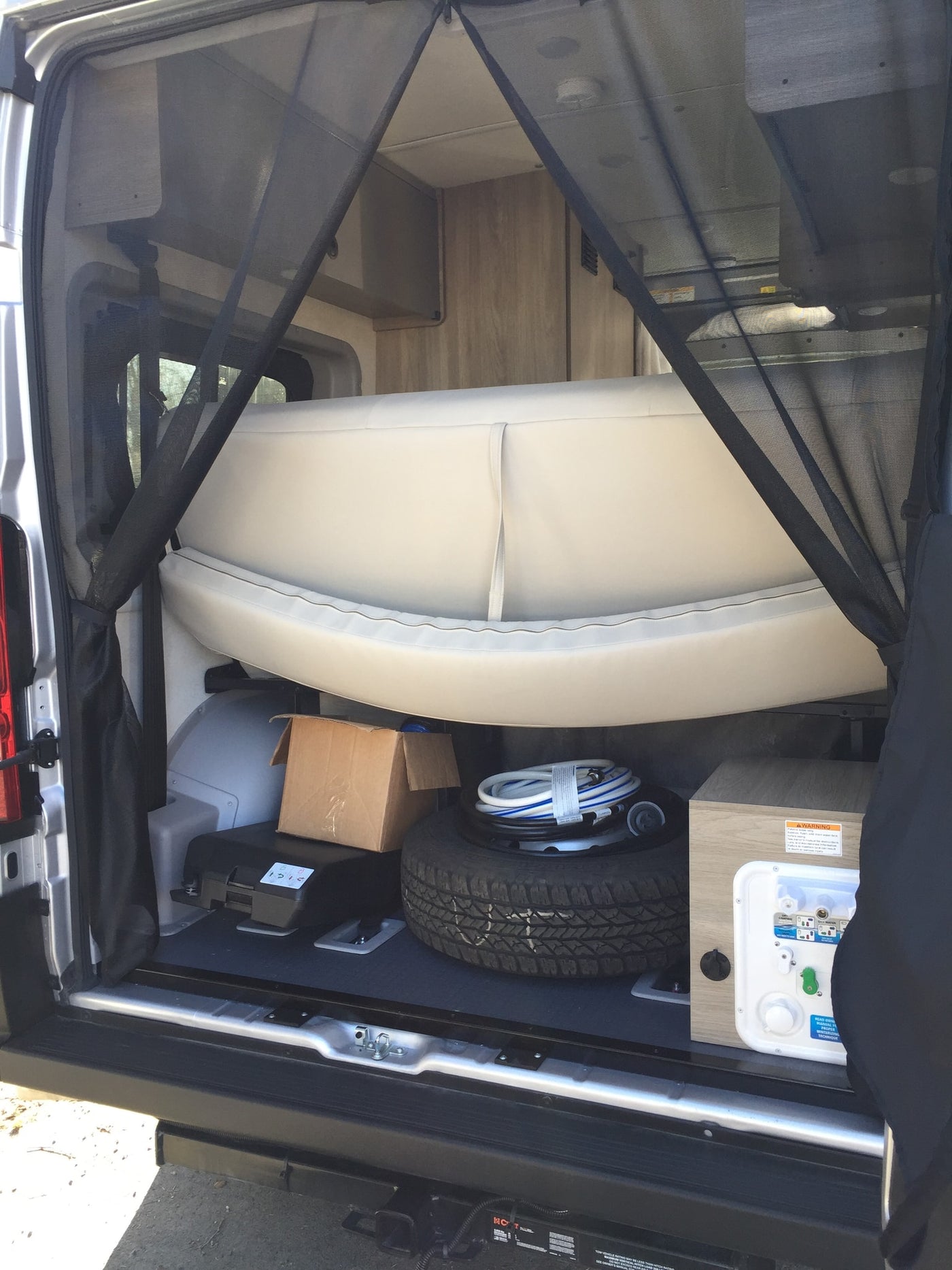  and safety bars.|Step inside this RV rental! A compact interior featuring a bright kitchen — photo 10