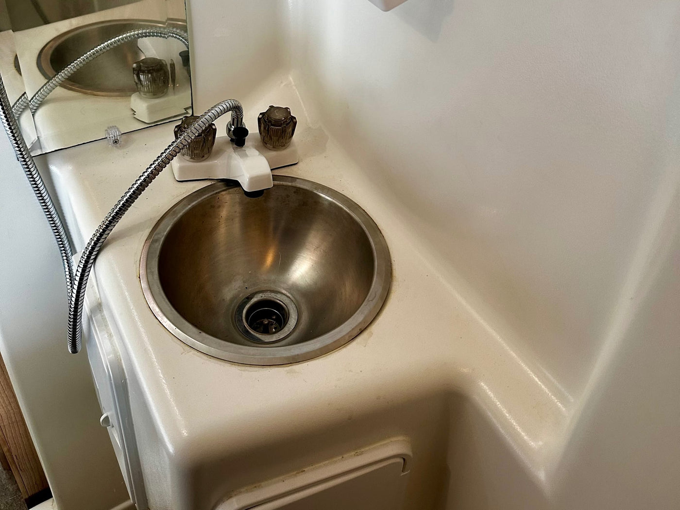 inviting outdoor adventure.|Light green RV rental: side door open with pleated screen — photo 12