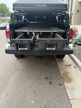Rear of pickup with iKAMPER rooftop tent & DECKED bed storage. Great for overlanding, an RV rental alternative.