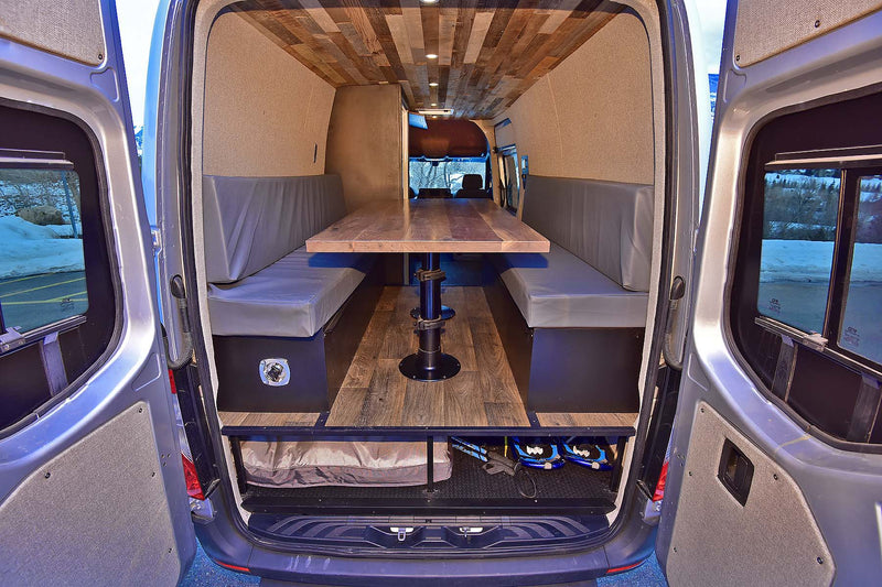  parked against snowy mountains.|Inside a spacious RV rental: modern kitchen — photo 4