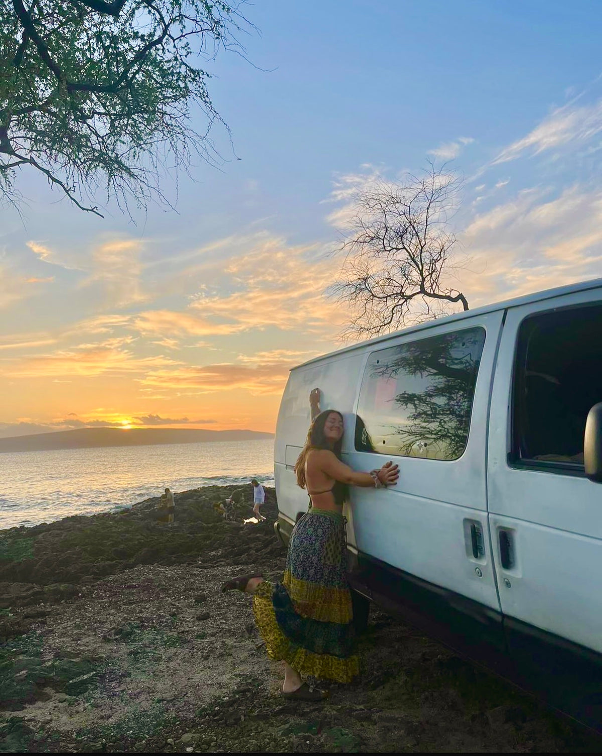  enjoying the ocean and colorful sky.|White Ford cargo van — photo 6