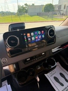  & screens for ultimate comfort on the road.|Step inside this premium rv rental. Spacious luxury interior features rows of quilted tan leather seating & ample legroom for comfortable travel.|Inside a luxury RV rental: rows of plush — photo 8