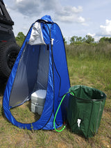 Ideal for RV rental trips: A blue privacy tent houses a portable toilet, paired with a green outdoor shower system.