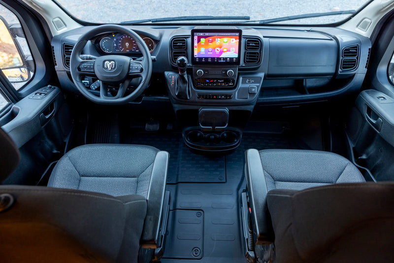 Interior of an RV rental: driver's view with large touchscreen, digital dashboard, and comfortable front seats. — photo 18