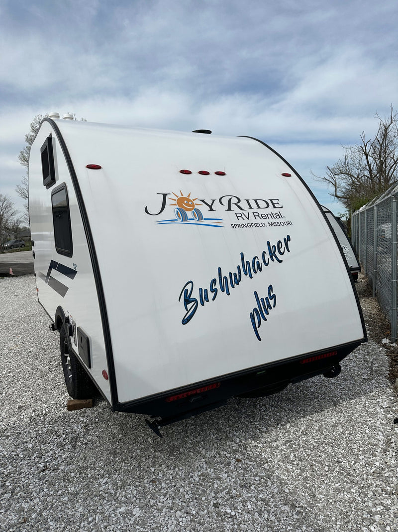 White Bushwhacker Plus travel trailer, available for rv rental from Joy Ride RV Rental. Ready for your next adventure! — photo 16