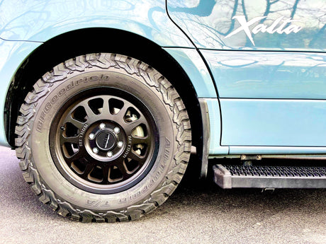"Xalla" RV rental van featuring robust BFGoodrich All-Terrain T/A KO2 tires and Method wheels, ready for rugged adventures.