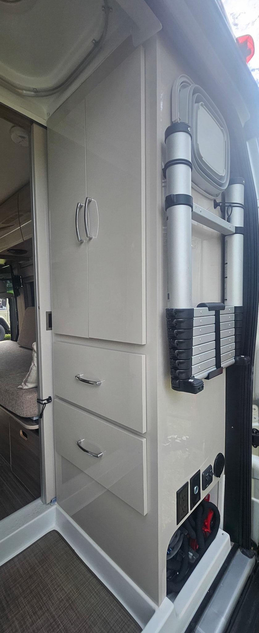  with a tiled floor and side counter.|rv rental: Modern interior with console — photo 12
