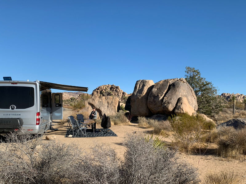  cooler & picnic table on sand near cliff.|Luxury rv rental: An Airstream Atlas RV — photo 12