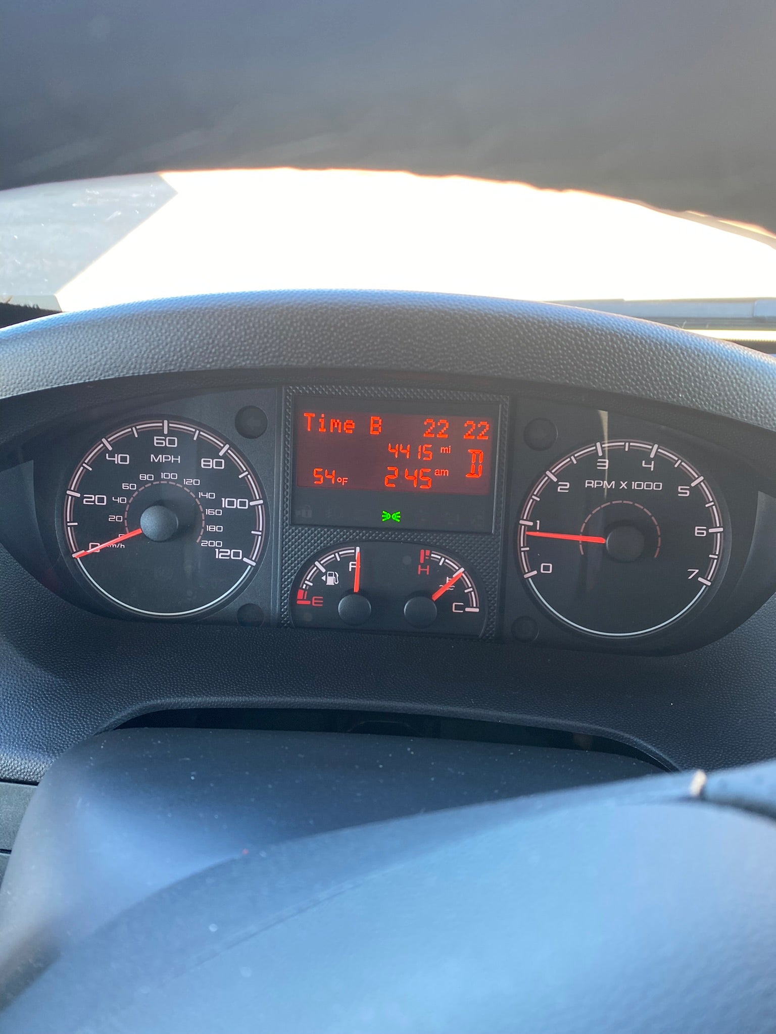 Dashboard of an RV rental showing speed, RPM, fuel, temperature, and digital readouts including 54°F, 4415 miles, and 2:45 AM.