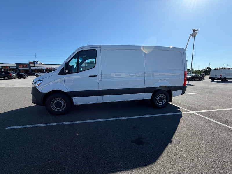 and front seats on a sunny day.|RV rental cargo van interior: cot — photo 10