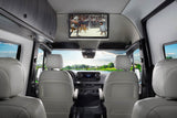 Enjoy a luxury RV rental! View the spacious Mercedes-Benz Sprinter interior with an overhead TV and scenic window views.
