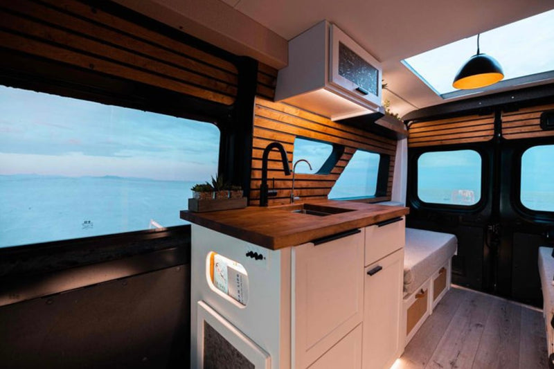  and ambient lighting.|Modern rv rental camper van interior. Comfy bench seats — photo 6