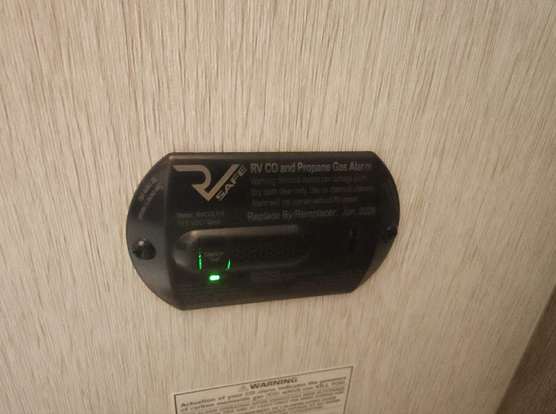  and a microwave.|RV rental interior: A compact kitchen with sink — photo 4