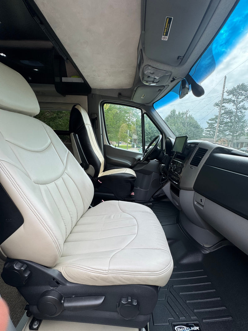 Inside an RV rental: View from the light-colored front passenger seat, showing the dashboard and driver's cabin. — photo 9