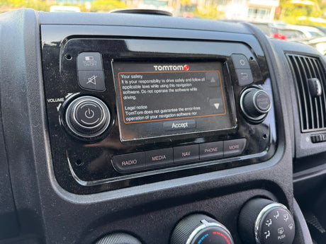 Inside an rv rental: TomTom navigation with safety warning. Essential in-car tech for clear routes and safe travel.