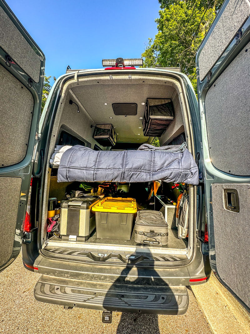  ready for adventure.|Modern RV rental interior showing a gray bed — photo 6