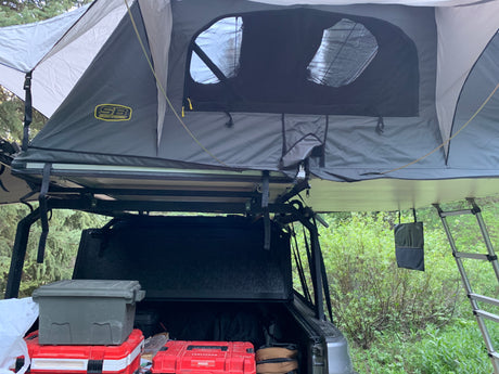 This Smittybilt rooftop tent on a truck offers an amazing overlanding alternative to an RV rental. Ready for outdoor adventure!