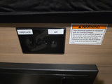 RV rental interior: an electrical panel with 'Fireplace' and 'A/C' switches, and a critical electrical safety warning.