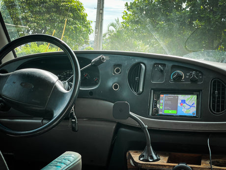 Inside an RV rental: Dashboard view with Ford steering wheel, keys, and a GPS navigating to Honolulu, Hawaii.