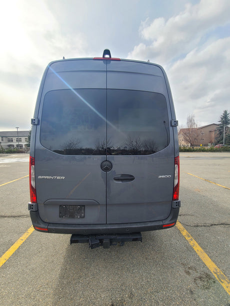 Rear of a grey Mercedes-Benz Sprinter 2500 van, perfect for RV rental conversion, with a hitch.