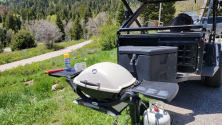  and fire pit in a snowy forest camp.|Perfect for your RV rental trip: A utility trailer with rooftop tent — photo 5