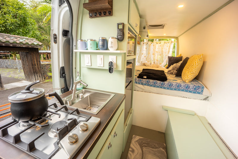 Cozy RV rental interior: fully equipped kitchen, comfy bed, and outdoor views for your next adventure. — photo 6