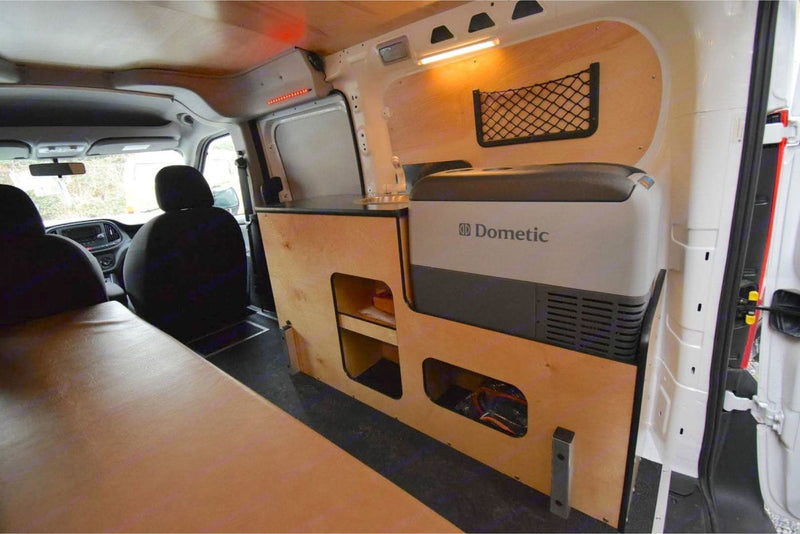  and a small sink.|Explore an RV rental camper van: fully equipped kitchen with sink — photo 6