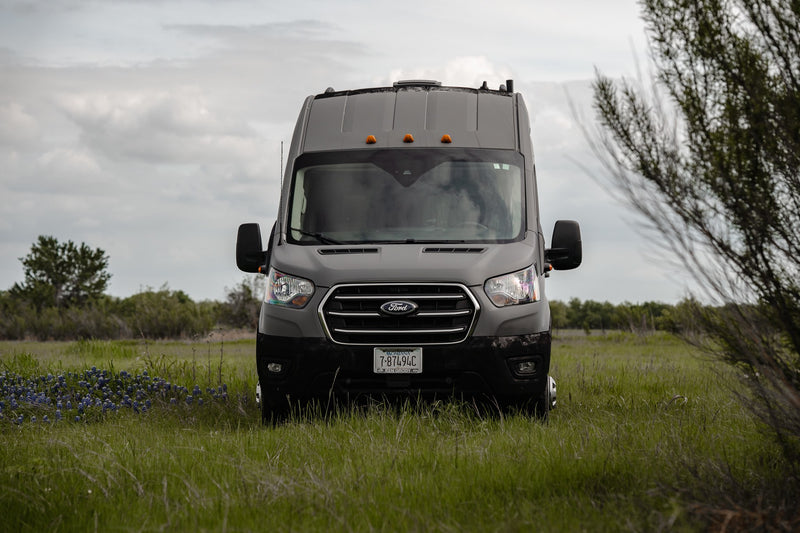  ready for off-grid travel.|Explore the outdoors with this grey camper van RV rental — photo 2