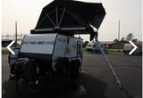 Explore the outdoors! This NO BO travel trailer with a rooftop tent is an ideal RV rental for camping adventures.