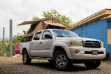 Our white Toyota Tacoma with a rooftop tent is the perfect RV rental for island camping adventures in Kauai.