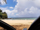 Scenic beach view from an RV rental, with sandy shores & ocean waves. Perfect trip stop!