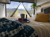 Your RV rental adventure starts here! Enjoy cozy comfort, coffee, and stunning mountain & lake views from bed.