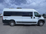 A white Dazzle camper van, perfect for an rv rental, with tinted windows, black trim, and roof-mounted AC.