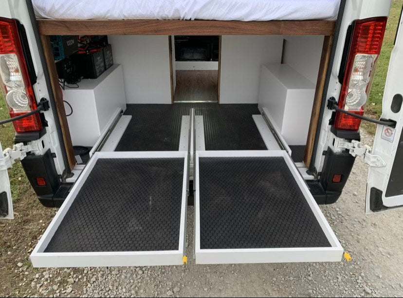  and wood flooring for your next adventure.|Rear view of a white Ram ProMaster camper van — photo 3