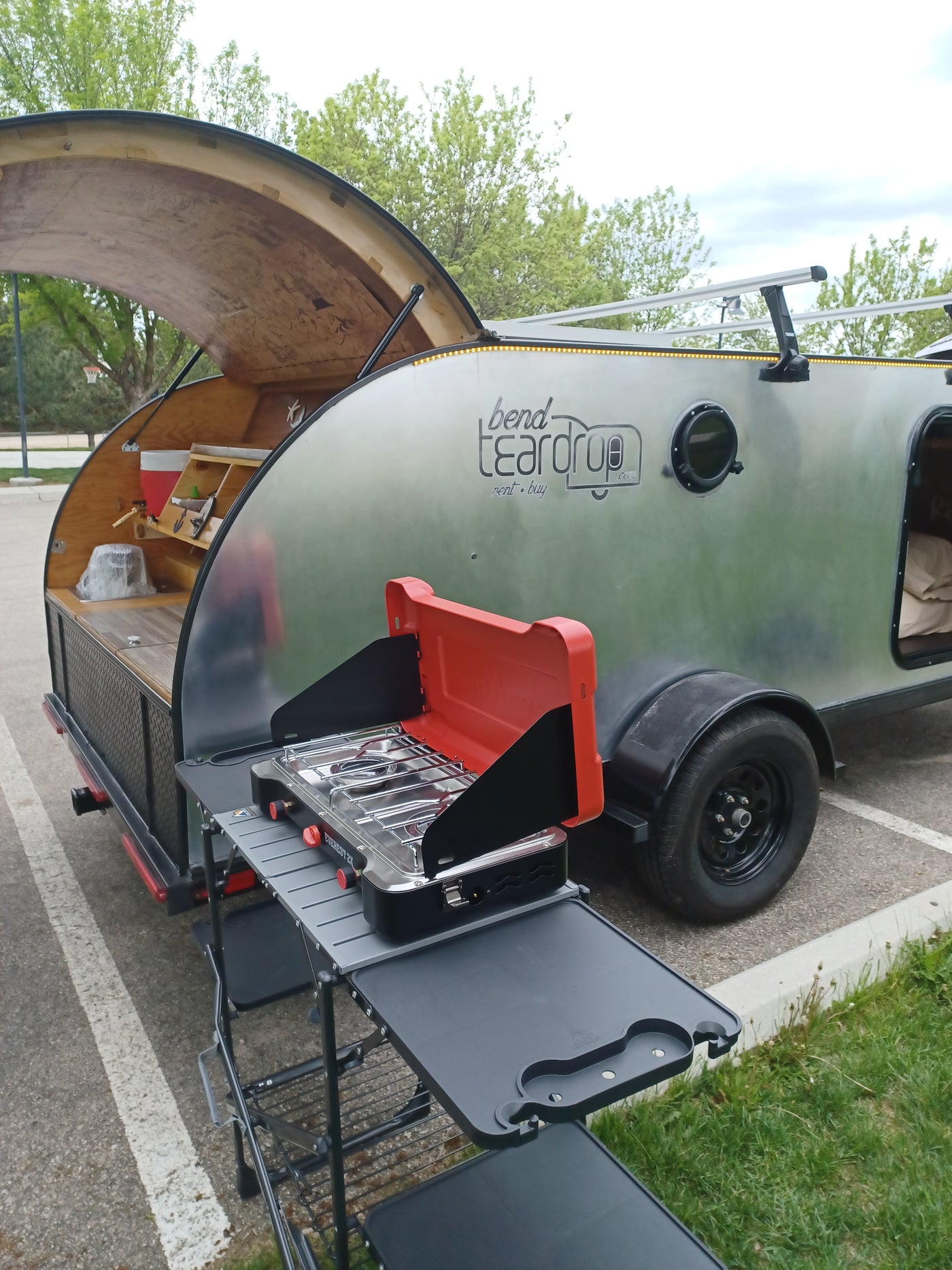 This Bend Teardrop RV rental features an open rear kitchen with a stove setup, ready for outdoor adventures. — photo 16