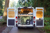 Adventure-ready RV rental: See inside this custom van conversion with bed, bike storage, and wooden details.