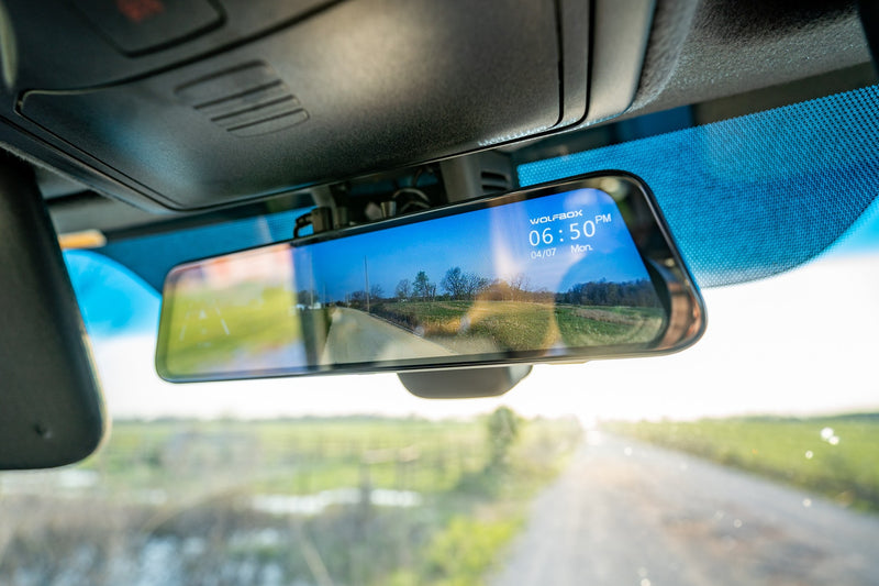 RV rental: Digital rearview mirror showing a live road view and time (6:50 PM), enhancing safety. — photo 3