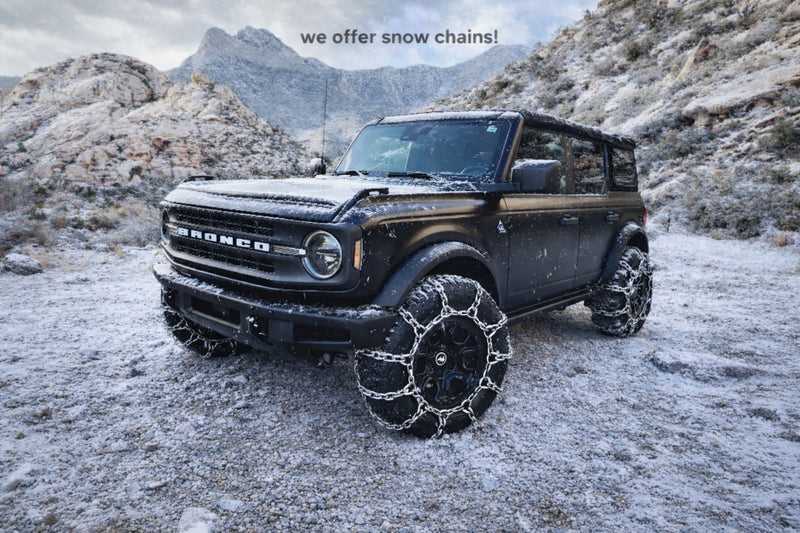  perfect for an RV rental journey.|A rugged black Ford Bronco off-roading in a scenic canyon. Ideal for adventure travel — photo 2