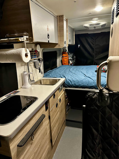  and comfy seating.|RV rental camper van interior: bunk beds