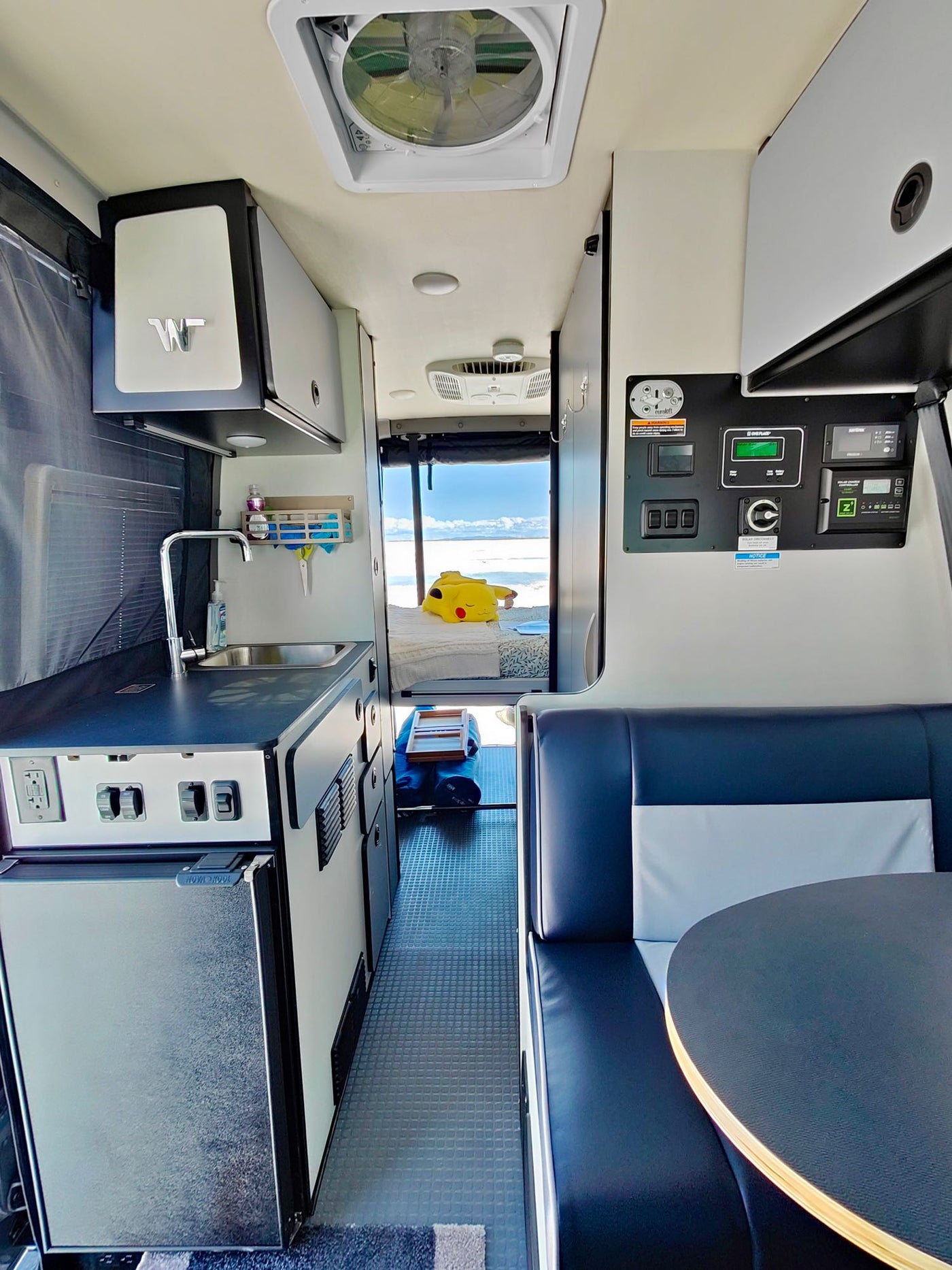  facing the wide-open salt flats for an adventure.|An RV rental offers a cozy bed view of the Bonneville Salt Flats — photo 9
